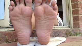 Asian girl shows her feet to send to classmates
